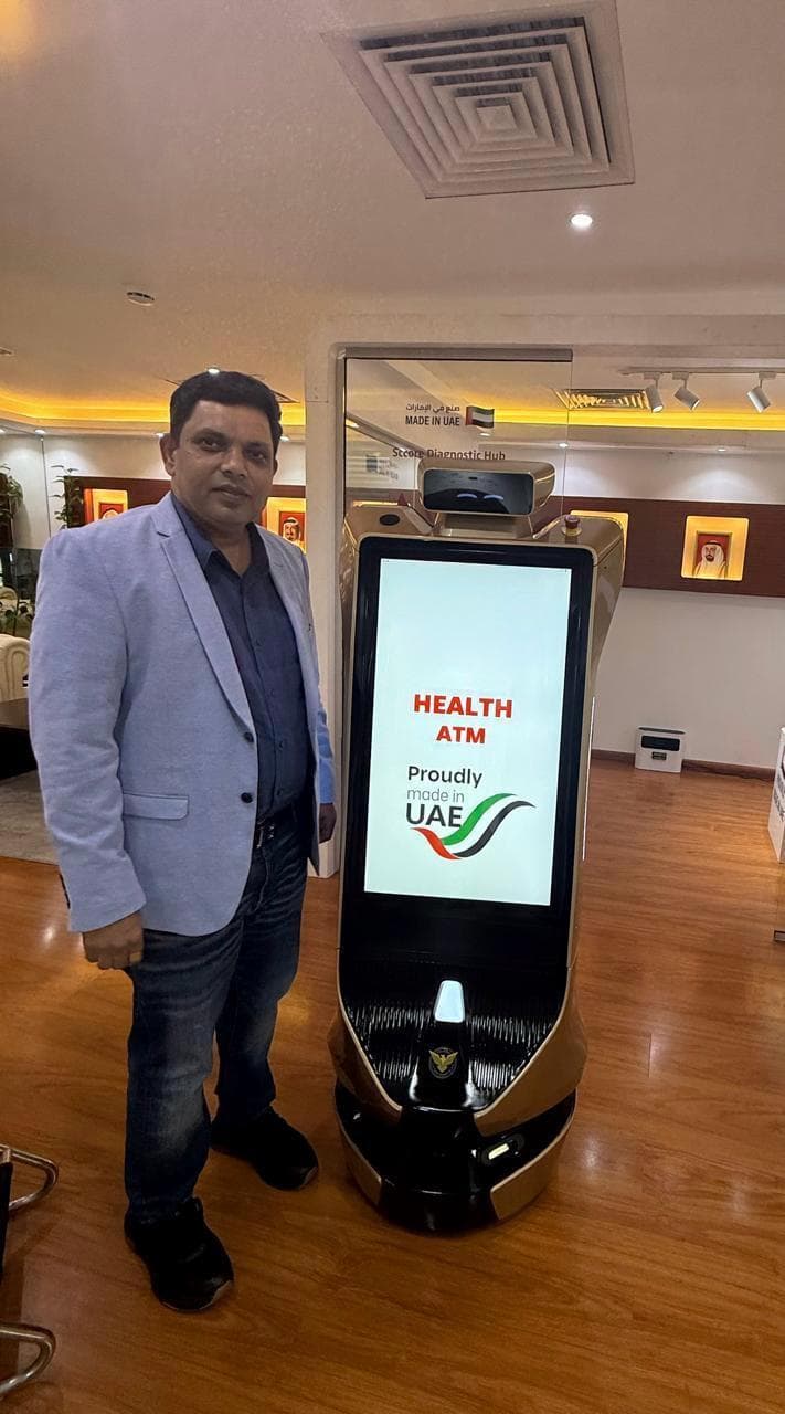 Team member standing beside the Health ATM