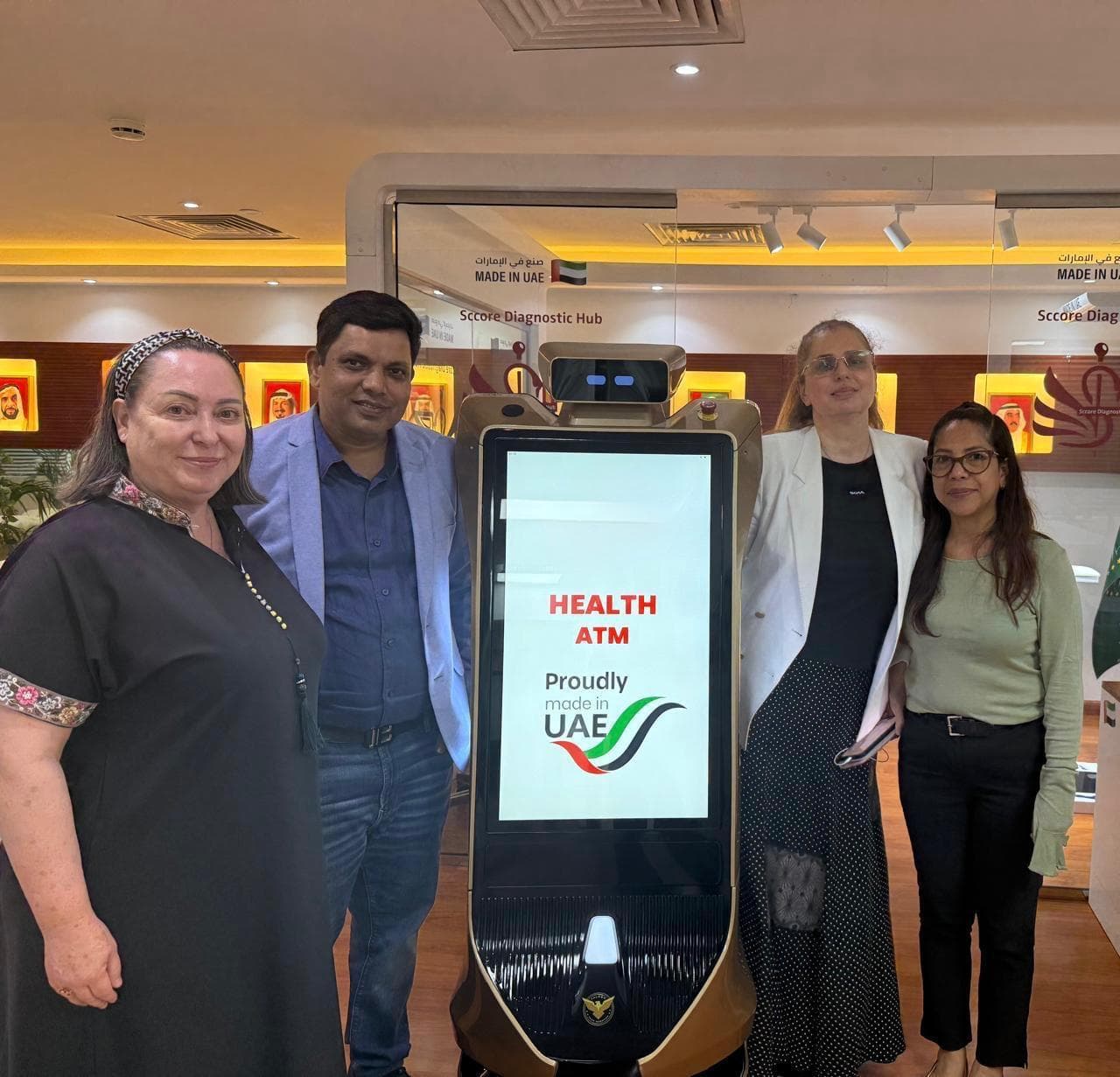 Group of four people with the Health ATM